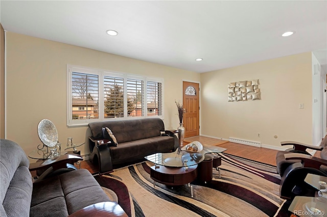 living area featuring recessed lighting, baseboards, and wood finished floors