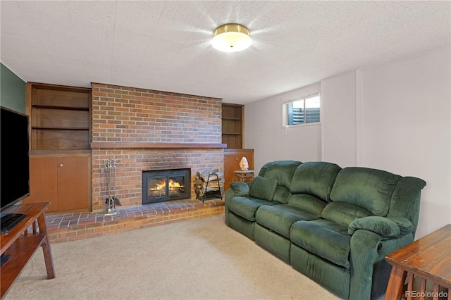 living room with carpet flooring, a fireplace, a textured ceiling, and built in features