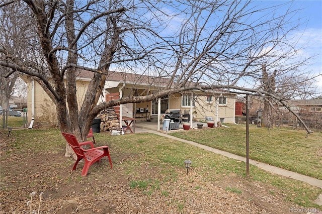 exterior space with a patio and fence