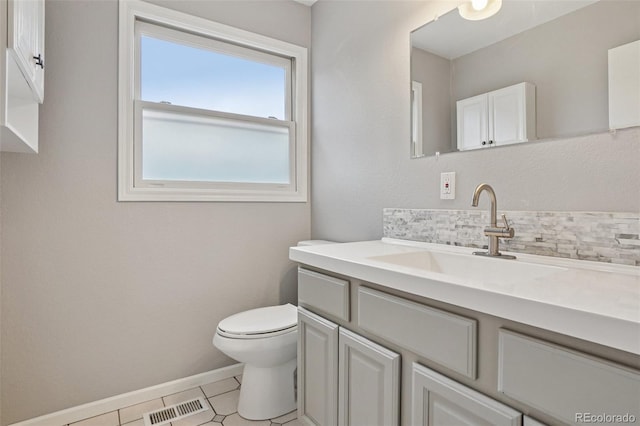 7667 W Brook Dr, Littleton, CO 80128 - bathroom featuring vanity, tile patterned flooring, and tasteful backsplash