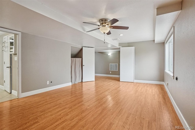 7667 W Brook Dr, Littleton, CO 80128 - unfurnished living room with ceiling fan and light wood-type flooring