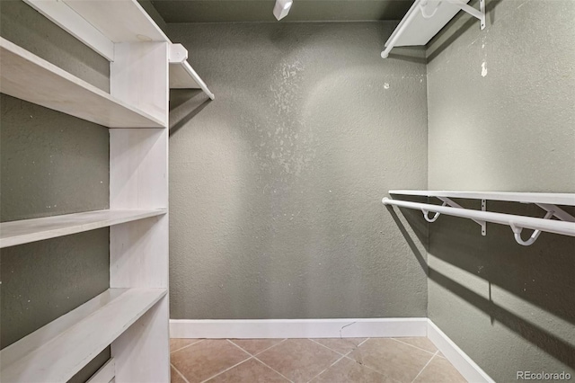 7667 W Brook Dr, Littleton, CO 80128 - walk in closet with tile patterned flooring