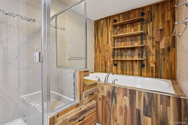 7667 W Brook Dr, Littleton, CO 80128 - bathroom featuring a tub to relax in and a tile shower