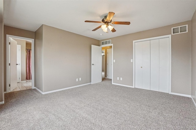 7667 W Brook Dr, Littleton, CO 80128 - unfurnished bedroom featuring carpet, a closet, and a ceiling fan