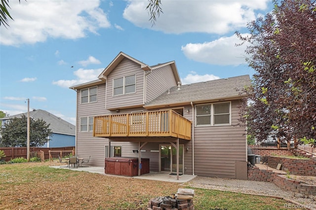 7667 W Brook Dr, Littleton, CO 80128 - rear view of house featuring a hot tub, a patio area, and a deck
