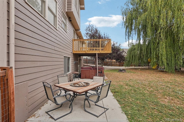 7667 W Brook Dr, Littleton, CO 80128 - fenced backyard with a hot tub and a patio
