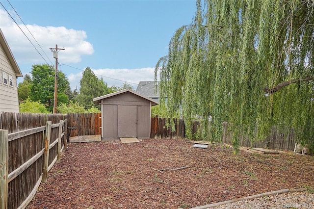 7667 W Brook Dr, Littleton, CO 80128 - fenced backyard with a shed