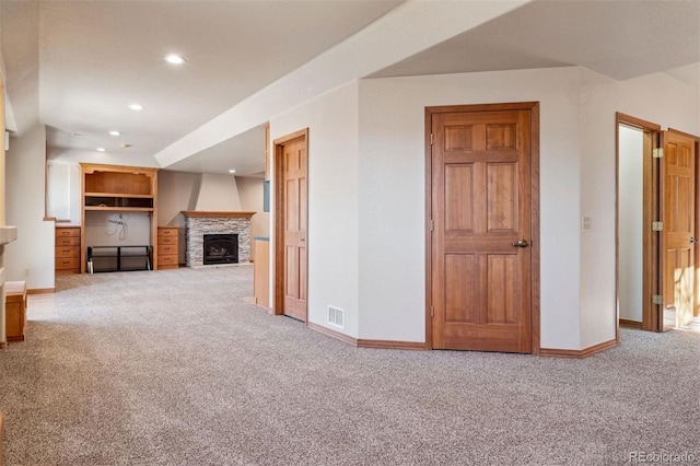 unfurnished living room with baseboards, visible vents, carpet flooring, and recessed lighting