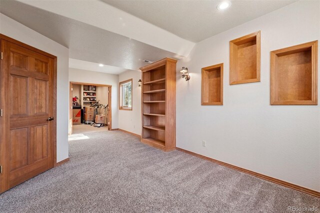 carpeted spare room with baseboards and recessed lighting