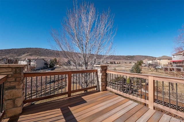 wooden terrace featuring a mountain view