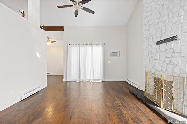 unfurnished living room with baseboard heating, a fireplace, a ceiling fan, and wood finished floors