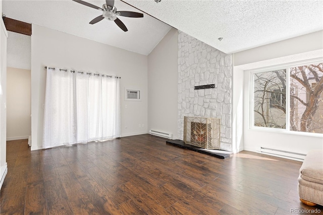 unfurnished living room with a baseboard radiator, lofted ceiling, a stone fireplace, and dark wood finished floors