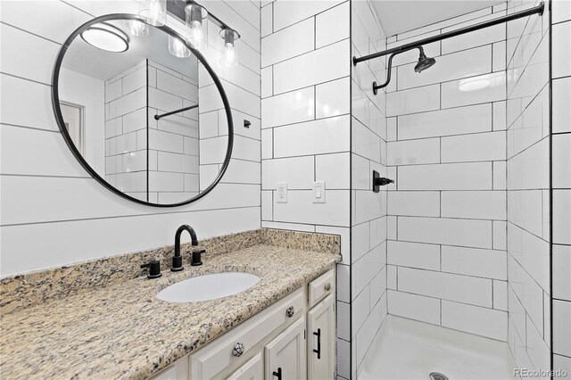4062 S Atchison Way Unit 302, Aurora, CO 80014 - bathroom featuring a stall shower and vanity