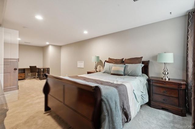 bedroom featuring light colored carpet and recessed lighting
