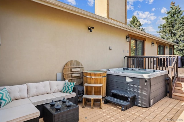 deck featuring a hot tub and outdoor lounge area