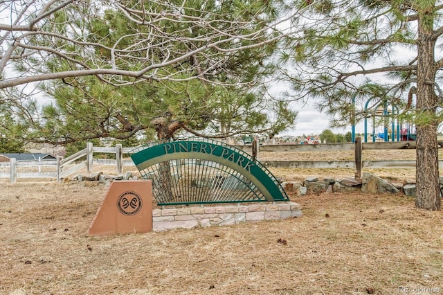 community sign with fence