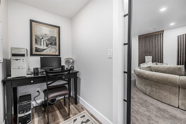 home office featuring recessed lighting, visible vents, baseboards, and wood finished floors