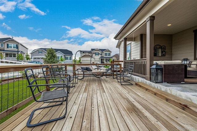 deck with outdoor lounge area and a residential view