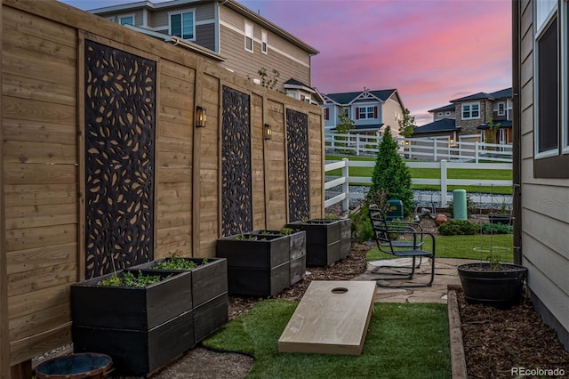 view of patio / terrace with fence and a garden