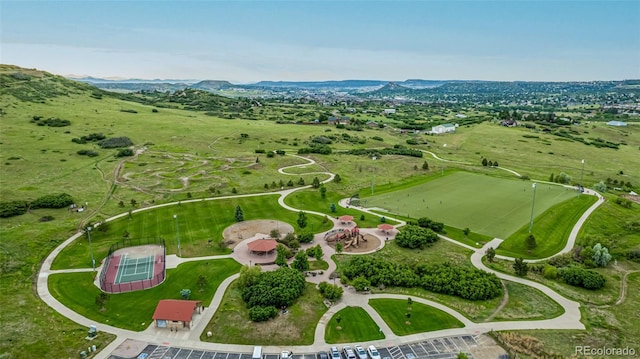 birds eye view of property with a mountain view