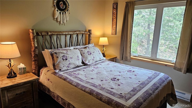 bedroom with a baseboard heating unit