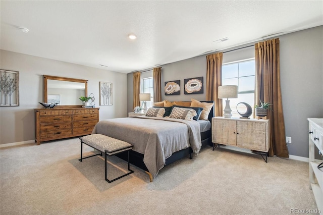 bedroom with light colored carpet