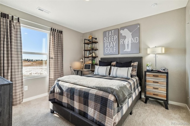 bedroom featuring light colored carpet