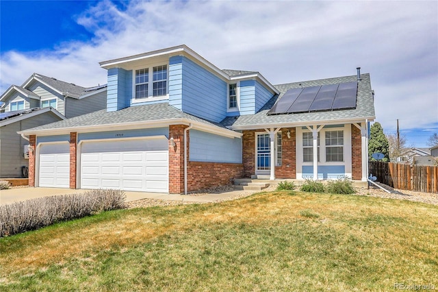 19939 E Belleview Ln, Centennial, CO 80015 - traditional-style house featuring concrete driveway, a front lawn, fence, solar panels, and brick siding