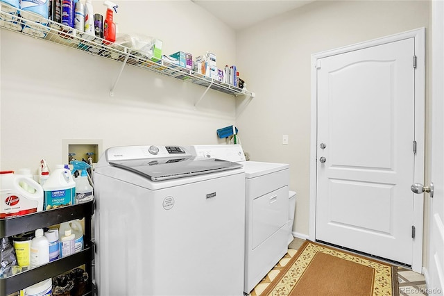 19939 E Belleview Ln, Centennial, CO 80015 - clothes washing area with washing machine and clothes dryer, baseboards, and laundry area