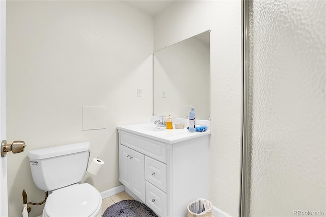 19939 E Belleview Ln, Centennial, CO 80015 - bathroom featuring baseboards, vanity, tile patterned flooring, and toilet