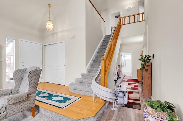 19939 E Belleview Ln, Centennial, CO 80015 - foyer featuring stairway, a towering ceiling, and wood finished floors