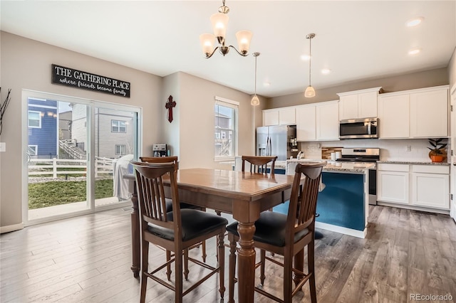 4781 Rosette St, Castle Rock, CO 80104 - dining area with a chandelier, dark wood-style flooring, and recessed lighting