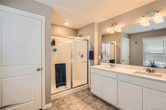 4781 Rosette St, Castle Rock, CO 80104 - full bathroom with a shower stall, double vanity, and plenty of natural light