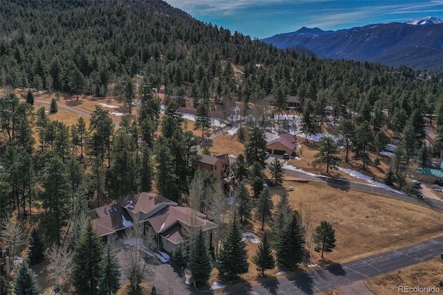 725 Sun Valley Dr, Woodland Park, CO 80863 - aerial view of property's location with a heavily wooded area and mountains