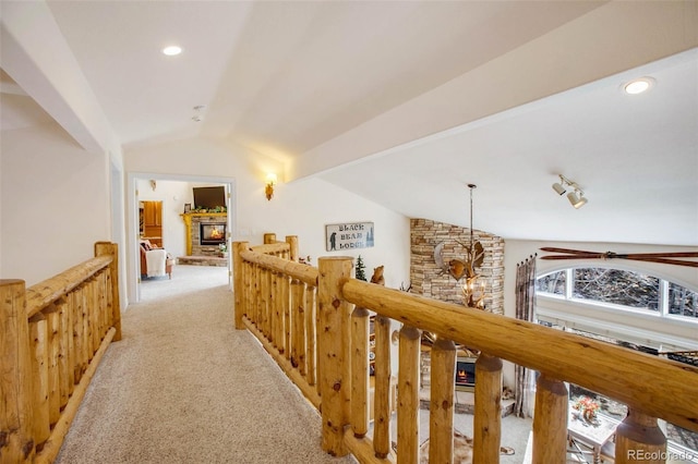 725 Sun Valley Dr, Woodland Park, CO 80863 - hall featuring vaulted ceiling, light carpet, an upstairs landing, and recessed lighting