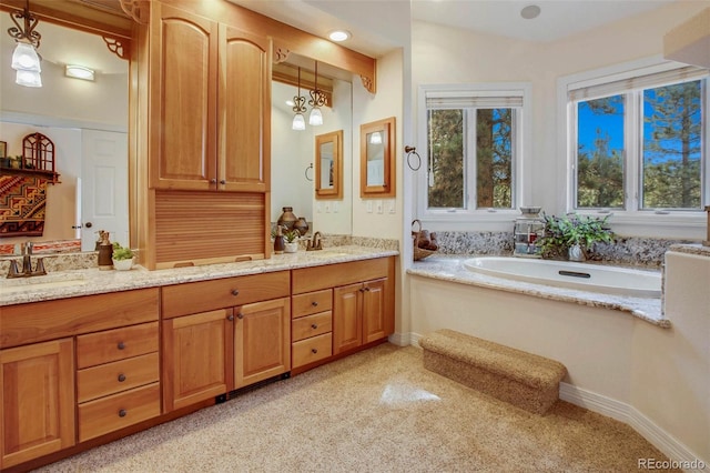 725 Sun Valley Dr, Woodland Park, CO 80863 - full bath featuring double vanity, a bath, carpet, and baseboards