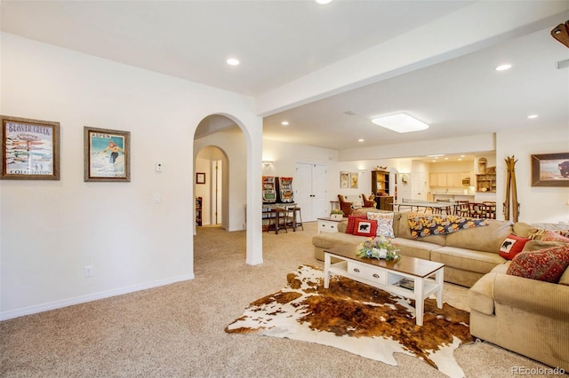 725 Sun Valley Dr, Woodland Park, CO 80863 - carpeted living area with arched walkways, recessed lighting, and baseboards