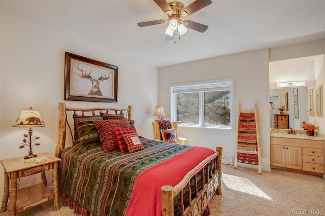 725 Sun Valley Dr, Woodland Park, CO 80863 - bedroom featuring light carpet, ensuite bath, and a ceiling fan