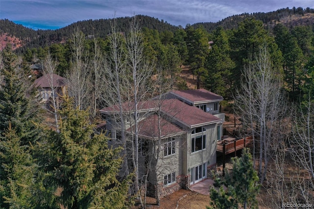 725 Sun Valley Dr, Woodland Park, CO 80863 - view of subject property featuring a forest and a mountain backdrop