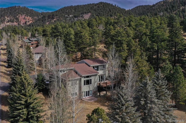 725 Sun Valley Dr, Woodland Park, CO 80863 - view of property location featuring a heavily wooded area and mountains