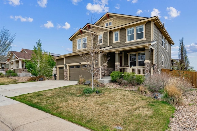 craftsman inspired home featuring fence, covered porch, concrete driveway, and stone siding