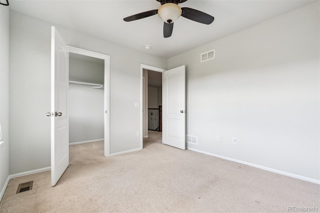 unfurnished bedroom with visible vents, baseboards, and carpet floors