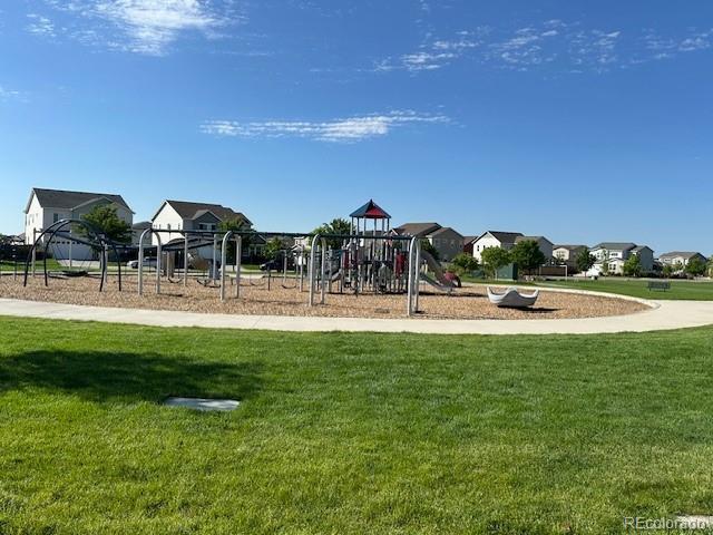 13440 Monaco St, Thornton, CO 80602 - communal playground featuring a lawn