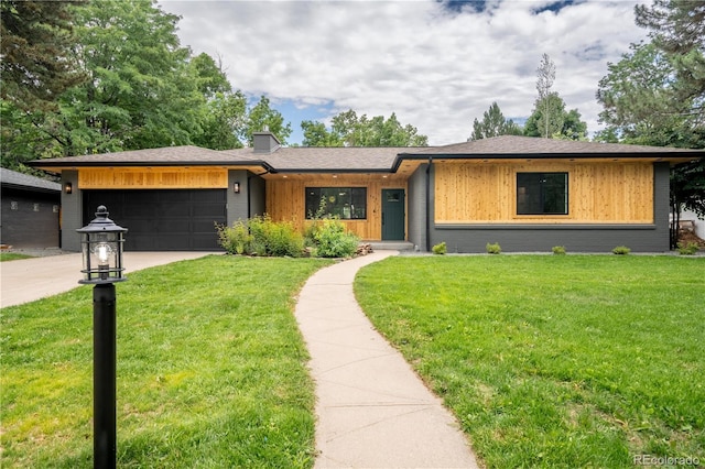 404 S Oneida Way, Denver, CO 80224 - view of front facade with an attached garage, concrete driveway, a front lawn, and board and batten siding