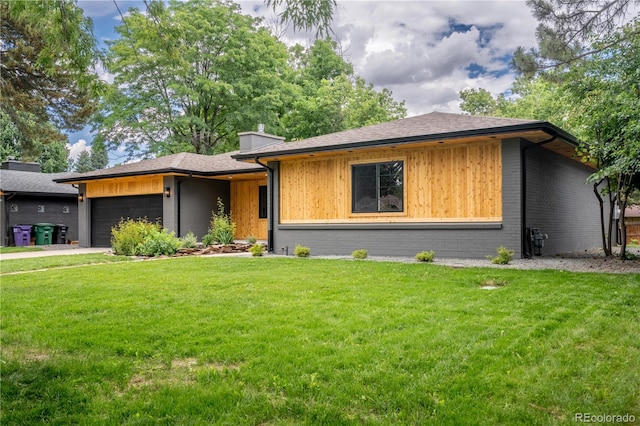 404 S Oneida Way, Denver, CO 80224 - view of front of home featuring a front lawn, an attached garage, and a chimney