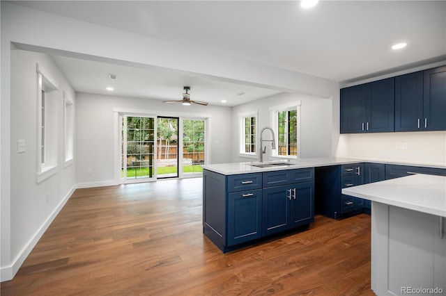 404 S Oneida Way, Denver, CO 80224 - kitchen featuring a peninsula, blue cabinetry, light countertops, a ceiling fan, and recessed lighting
