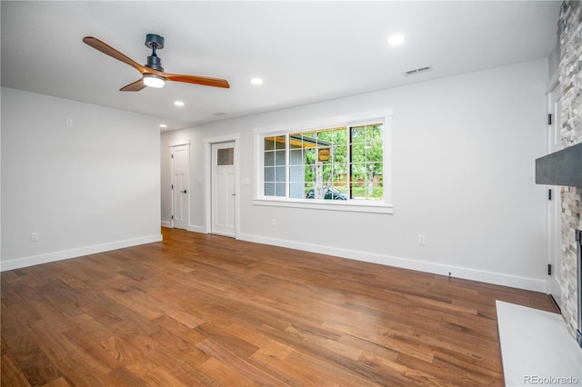 404 S Oneida Way, Denver, CO 80224 - unfurnished living room with a fireplace, a ceiling fan, wood finished floors, and recessed lighting