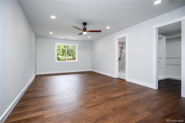 404 S Oneida Way, Denver, CO 80224 - unfurnished bedroom featuring dark wood-type flooring, a walk in closet, recessed lighting, ensuite bathroom, and a ceiling fan