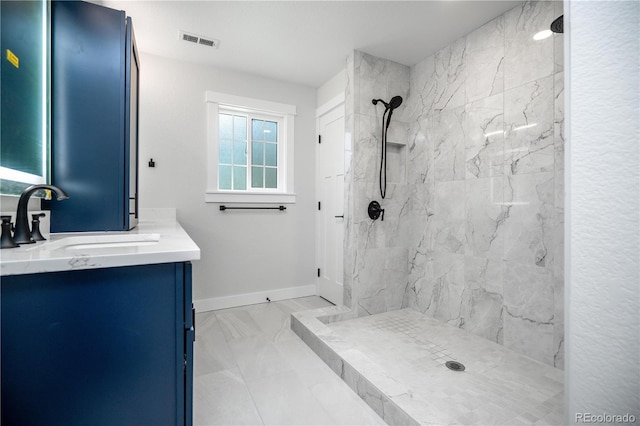 404 S Oneida Way, Denver, CO 80224 - bathroom with marble look tiles, vanity, and a marble finish shower
