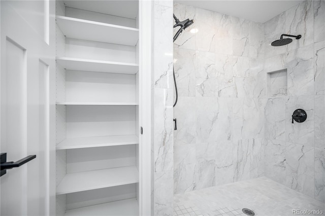 404 S Oneida Way, Denver, CO 80224 - bathroom featuring a marble finish shower and a closet